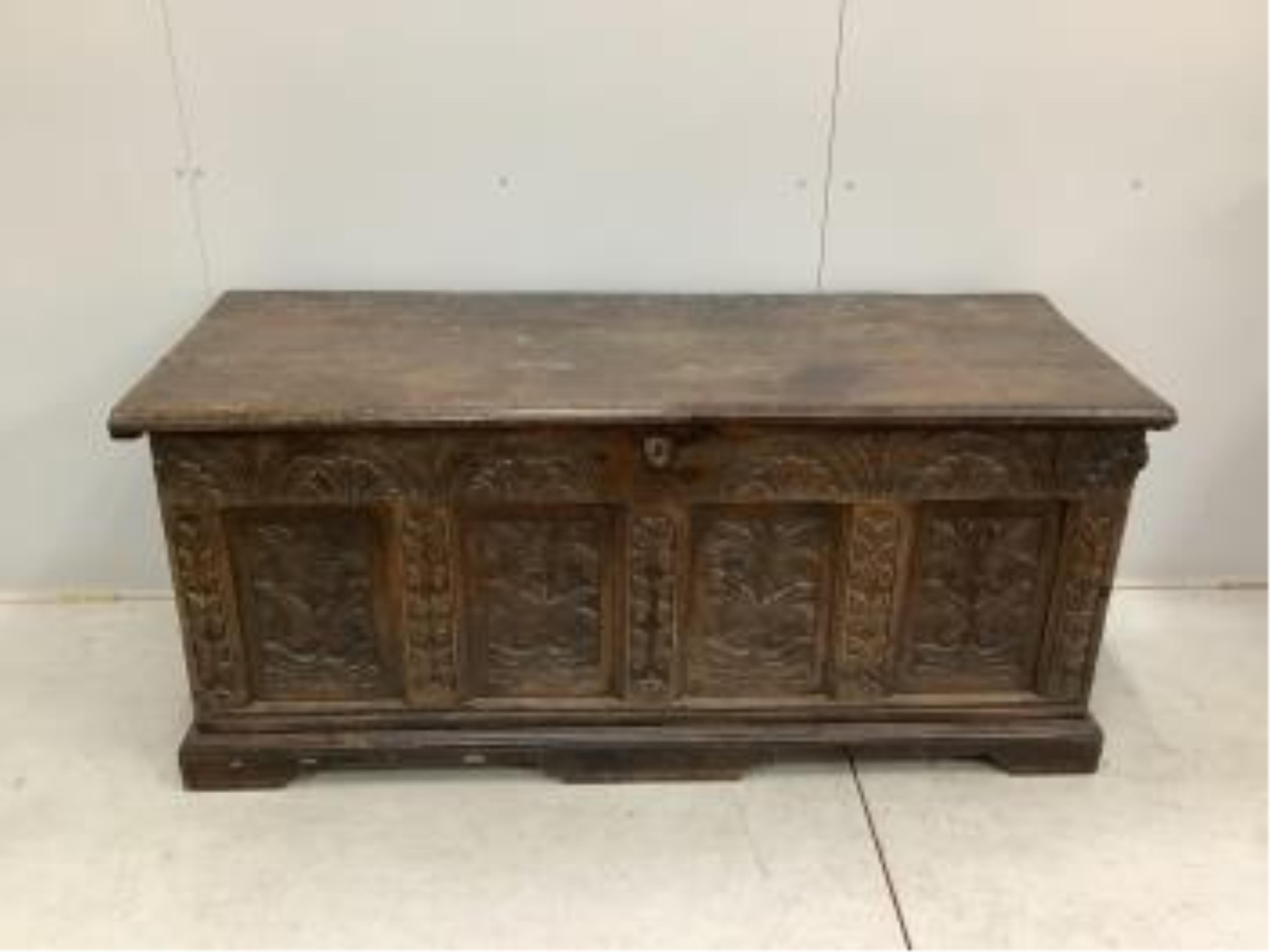 A 17th century and later strapwork carved oak coffer, width 160cm, depth 61cm, height 70cm. Condition - poor to fair